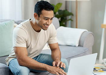 Latinx student working on laptop